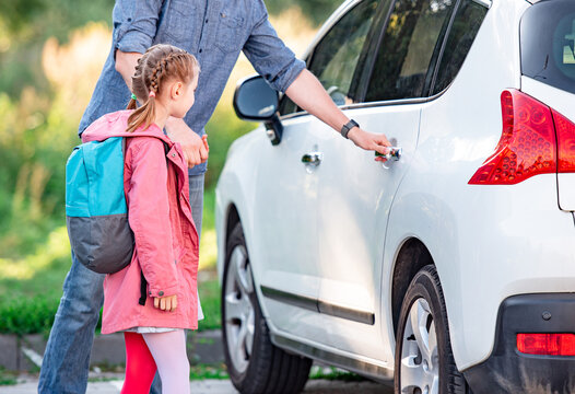 Father meeting daughter after school