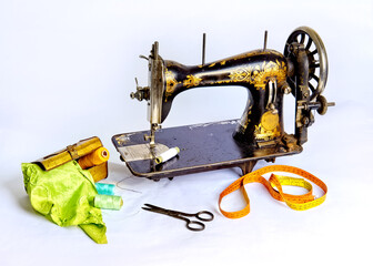 Old, historical sewing machine, sissers and equipment