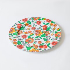 High angle shot of a beautiful floral plate isolated on a white surface