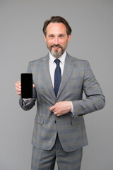 Man formal clothes manager showing mobile screen, business technologies concept