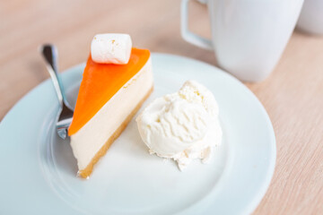 A piece of original cheesecake served with ice cream