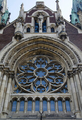 Beautiful architecture detail. Gothic style window. Ornamented rose window of a cathedral in gothic style. Lviv, Ukraine