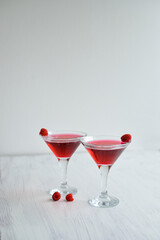 Pink sparkling cocktail standing on the white background