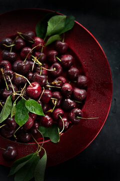 Red cherries on a Red Plate 