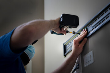 An electrician at work during COVID - small business 