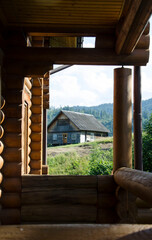 Fototapeta na wymiar Wooden house in the forest. Carpathian Mountains, Ukraine