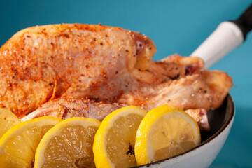 chicken with lemon in a pan