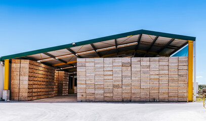 Piles of crates in agricultural building - Te Puke, Bay of Plenty, North Island, New Zealand