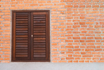 Wooden windows and red brick walls.