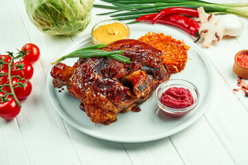 Appetizing baked pork shank in beer and honey with fried cabbage and mustard. Traditional German and Czech beer snack.