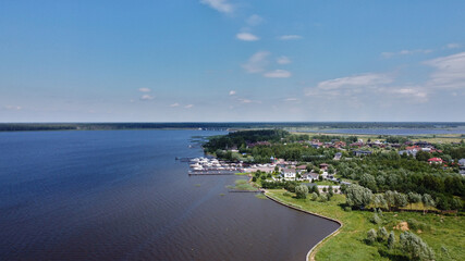 Fototapeta na wymiar Volga river with boats and cargo ship.