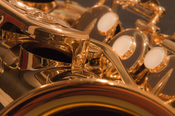 Close up of the mechanics of a brass alto saxophone