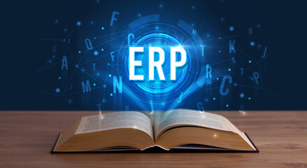 ERP inscription coming out from an open book, digital technology concept