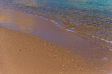 Closeup of the sand on beach and Red sea water