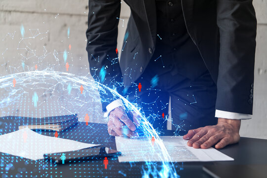 Businessman in suit signs contract. Double exposure with social media and planet hologram. Man signing agreement on research. People network concept.