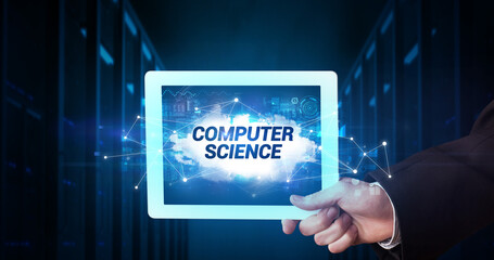 Young business person working on tablet and shows the inscription: COMPUTER SCIENCE
