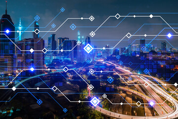 Information flow hologram, night panorama city view of Kuala Lumpur. KL is the largest technological center in Malaysia, Asia. The concept of programming science. Double exposure.