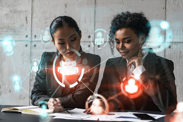 Two businesswomen work together in modern office on new project. Double exposure. Concept of success. Social network theme drawing.