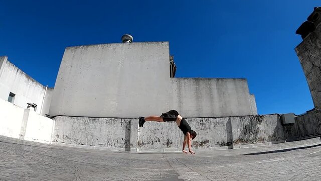 Man jumping flips on the street