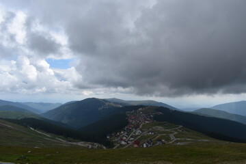 clouds over the mountains an mountain village
