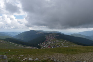 mountain landscape with clouds and mountain village