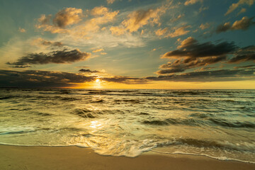 Sunset by the sea. Nature and nature landscape at sunset.