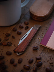 Slip joint pocket knife on wooden table