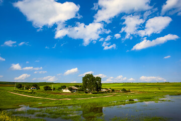  A household outside of the village. A fabulous sky and clouds.