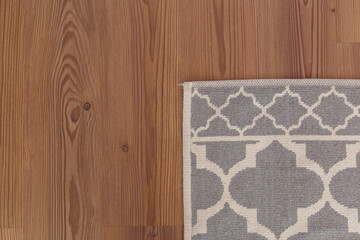Laminated parquet floor. Light wood texture. Modern cozy soft carpet. Warm interior design