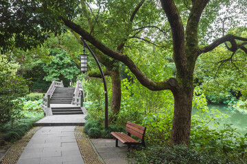 Footpath leading to bridge in park in West Lake scenic area,  Hangzhou, China