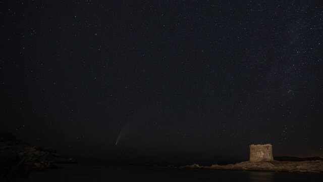 Timelaps from La Pelosa beach, in front of the medieval tower, visible on the sky the comet Neowise, Stintino, Sassari - Sardinia