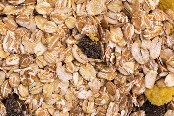 oatmeal with raisins, coconut, pineapple and banana slices isolated on a white background. For packing oatmeal or granola.