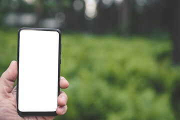 person using mobile phone outdoors