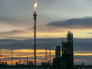 Petrochemical plant in morning right with copy space on top.