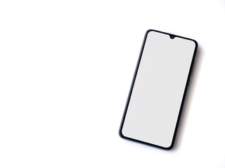 Black mobile smartphone mockup lies on the surface with blank screen isolated on white background