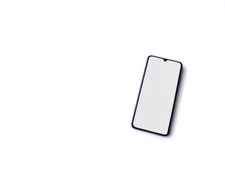 Black mobile smartphone mockup lies on the surface with blank screen isolated on white background