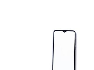 Black mobile smartphone mockup lies on the surface with blank screen isolated on white background