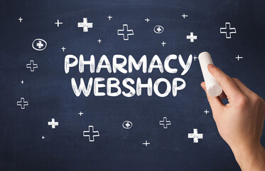 Hand drawing PHARMACY WEBSHOP inscription with white chalk on blackboard, medical concept