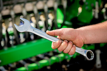 The mechanics repair combine harvester. Modern agricultural machinery