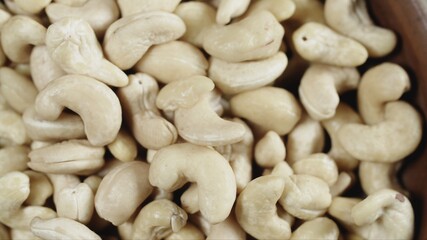 Top view of Cashew closeup in wooden bowl