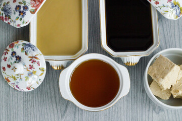 Traditional Turkish Halva,honey and molasses group on wooden table.Top view