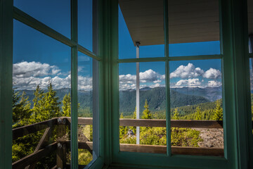 Fototapeta na wymiar View of the Mountains From a Window