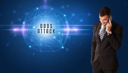 Businessman thinking about security solutions with DDOS ATTACK inscription