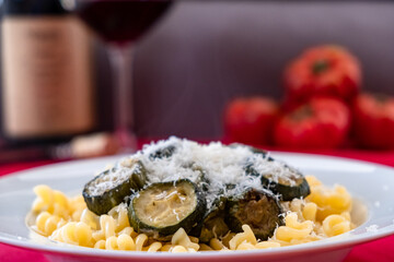 Italian food: pasta with zucchini and parmesan