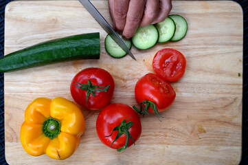 Closeup of fresh vegetables on a wooden board.