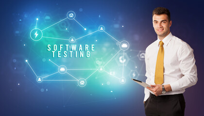 Businessman in front of cloud service icons with SOFTWARE TESTING inscription, modern technology concept