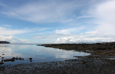 Pristine water scenes with reflections and brilliant blue skies