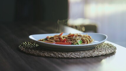 Hot And Steaming Asian Wok Noodles With Chiken and Vegetables