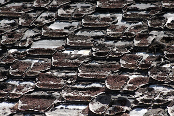 Old wooden boards and shingles from ghost town for vintage background pattern