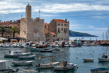 Panorama of Komiza, settlement and fishing port on island Vis on Adriatic sea in Croatia